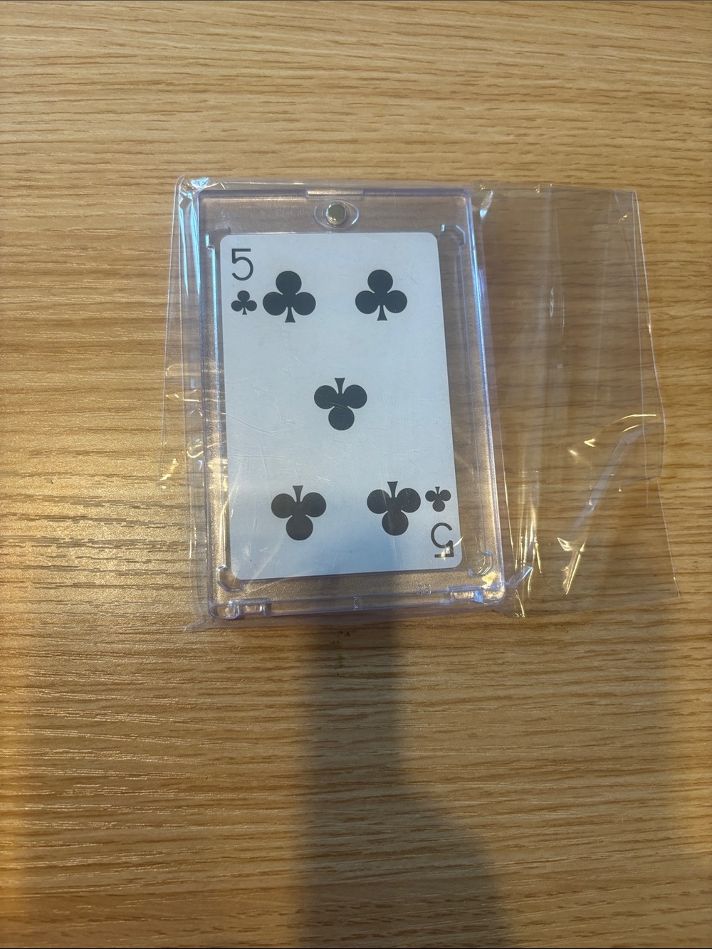 Tiffany playing card in a Clear Acrylic Playing Card Display with 5 of Clubs